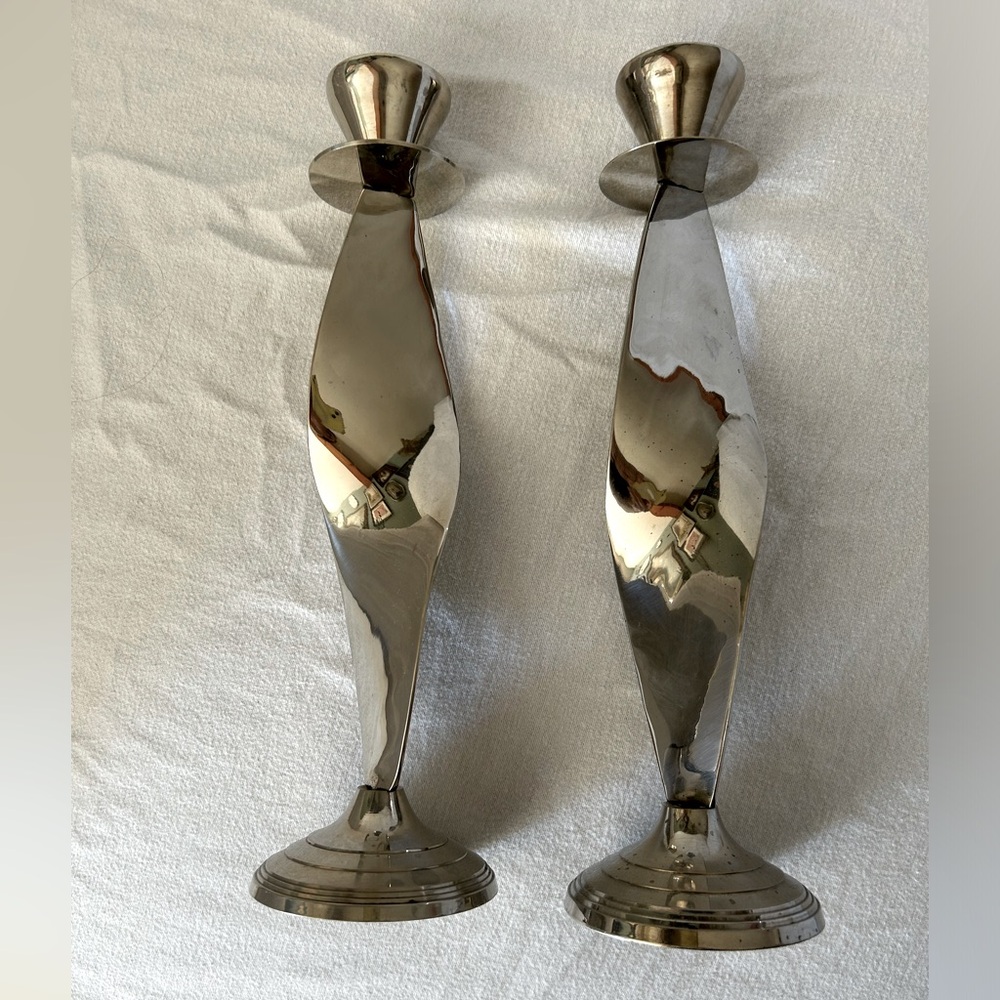 A pair of mid century silver plated spiral candlesticks.